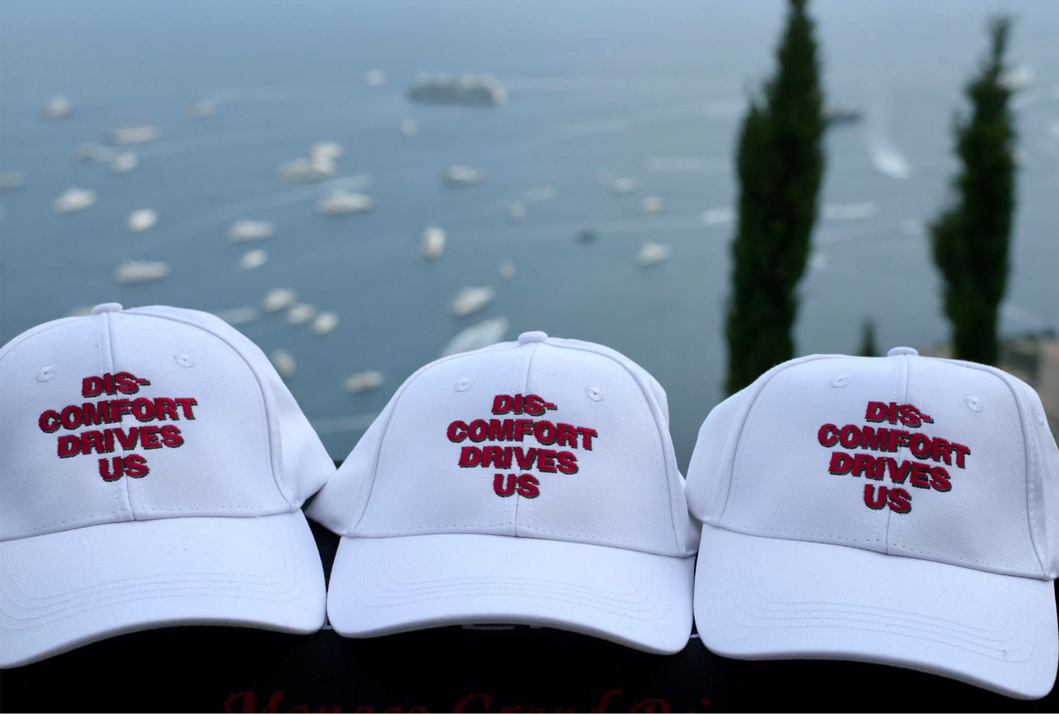 DISCOMFORT DRIVES US – Cap